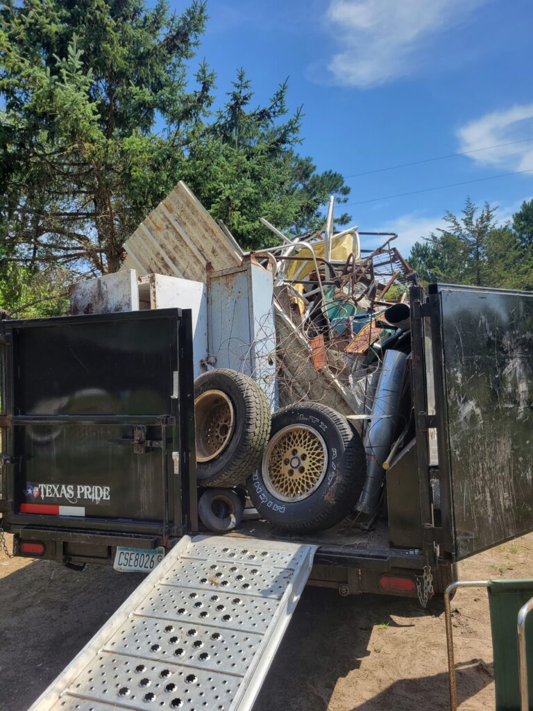 Junk removal clean out services. Trailer full of various junk items.