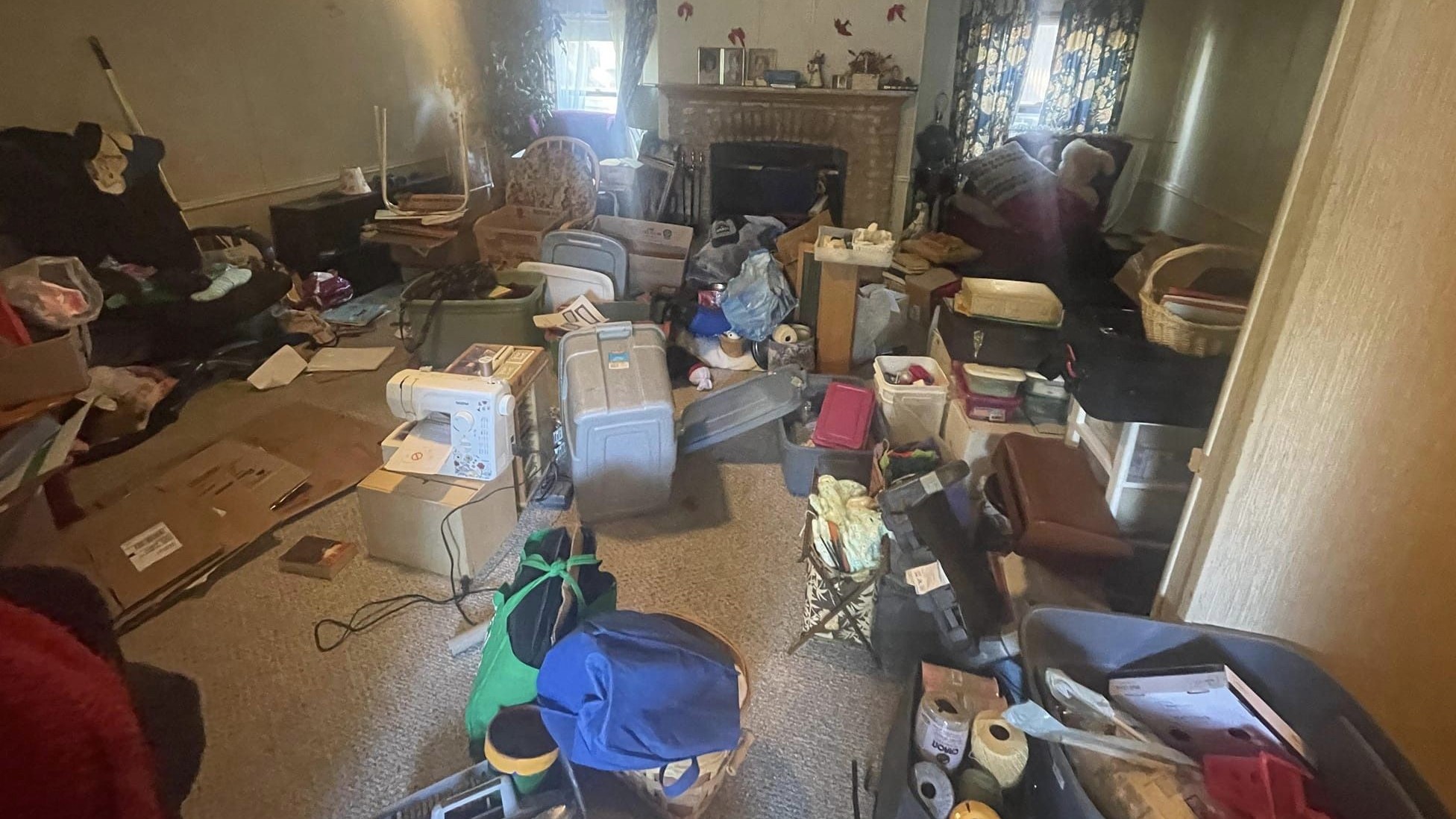 A cluttered room full of junk prior to a house clean out.