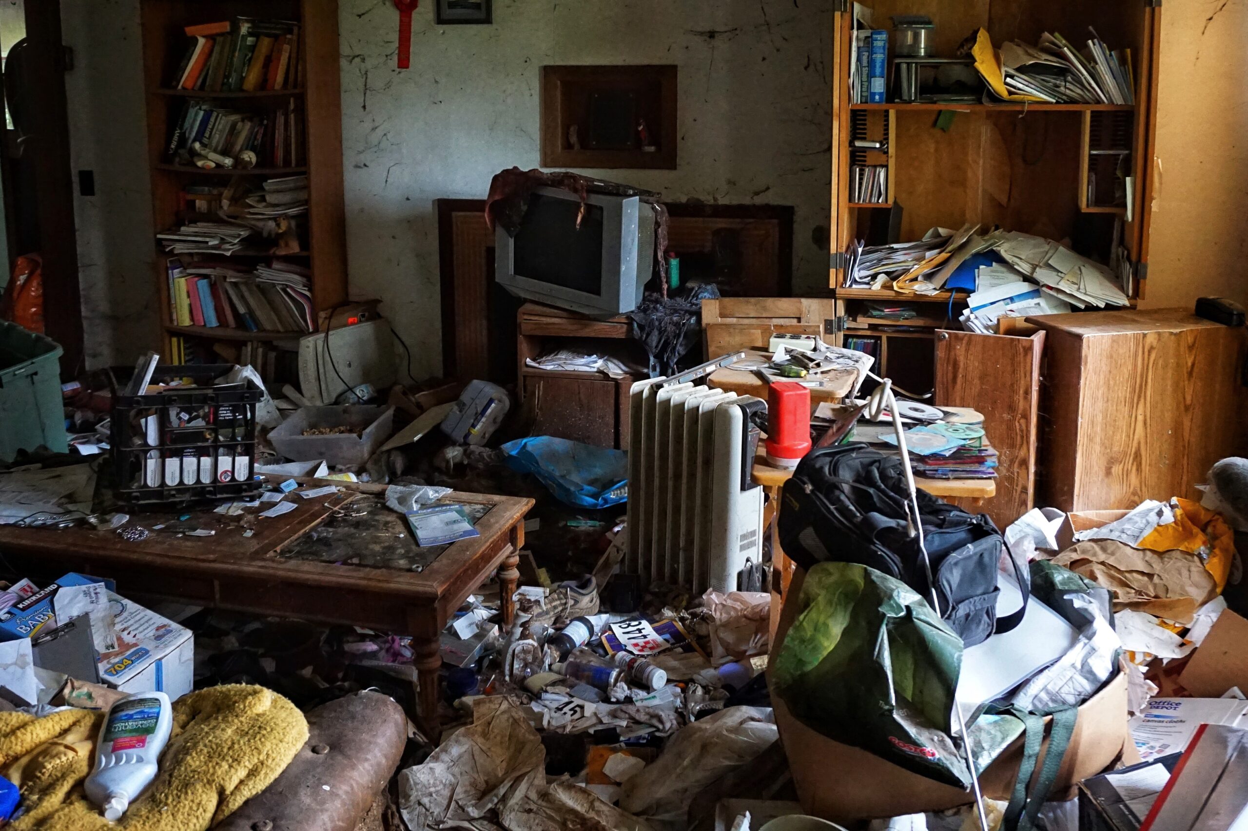 Property Management Services. An extremely cluttered and trashed house.